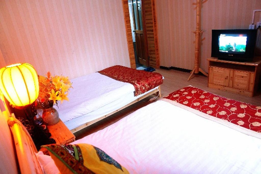 Yunxi Inn Ліцзян Номер фото